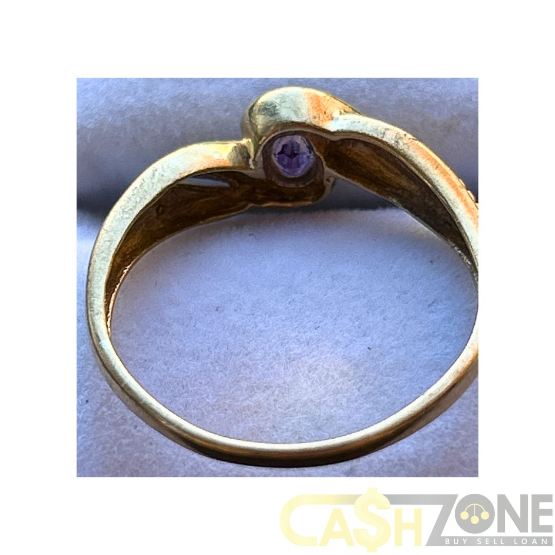 9CT Yellow Gold Ladies Twist Ring W/Purple Stone