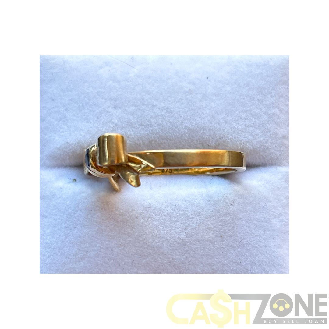 9CT Yellow Gold Ladies Bow Ring W/ Blue Stone