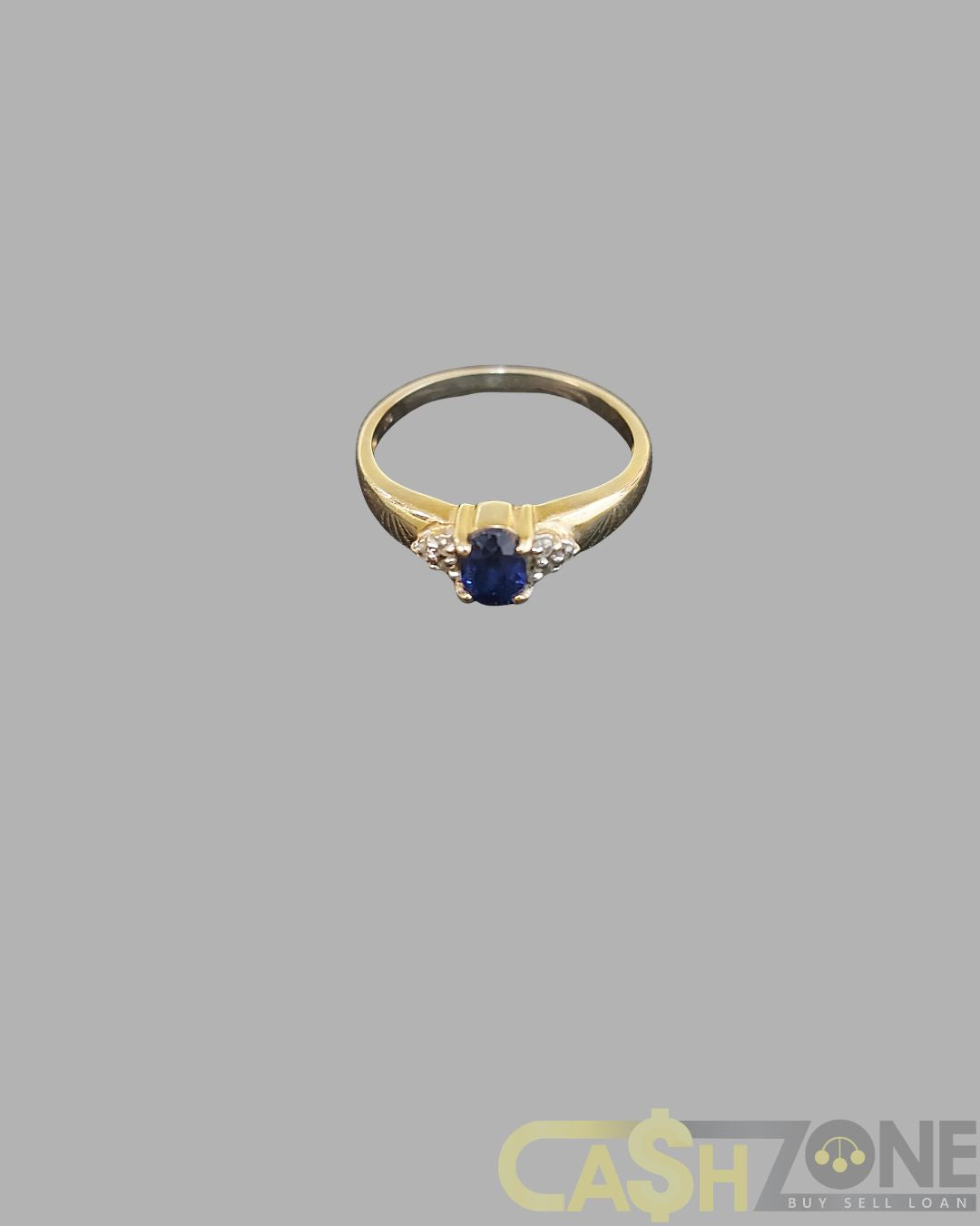 Ladies 9ct Yellow Gold Ring With Blue Stone and Clear Stones