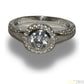 LADIES SILVER RING WITH 1 CLEAR STONE AND SURROUNDED WITH 21 SMALL STONES SIZE- M